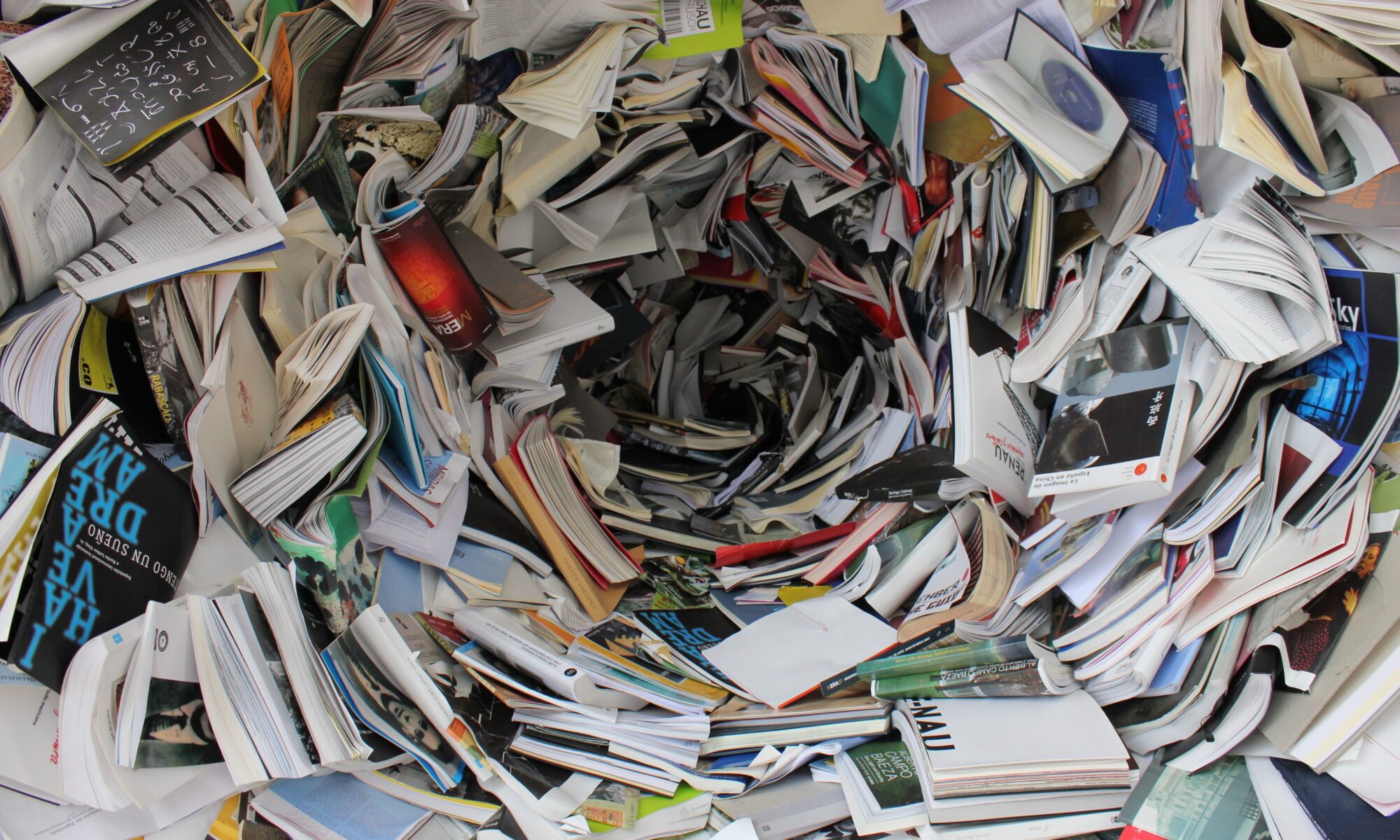 an overwhelming messy pile of books